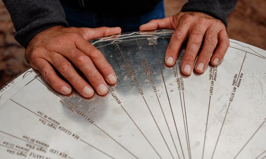 A detail of a climbers hands at the top of Arthurs seat an extinct volcano near Edinburgh city center