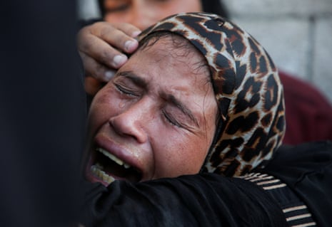 A mourner reacts during the funeral of Palestinians killed overnight in Israeli attacks on tents, according to Gaza's health ministry, at Nasser hospital in Khan Younis, southern Gaza Strip, 9 July 2025.