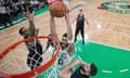 Boston Celtics forward Jayson Tatum (0) dunks the ball over Dallas Mavericks forward Derrick Jones Jr (left) and forward Maxi Kleber (right) during Game 1.