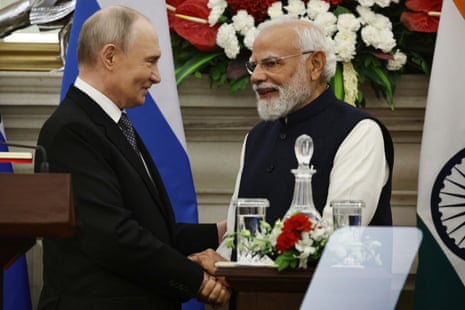 Indian Prime Minister Narendra Modi, right, and Russian President Vladimir Putin shake hands after making a press statement following their talks at the Hyderabad House in New Delhi, India on Dec. 5, 2025.