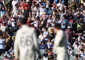 The Barmy Army cheer on the England players.