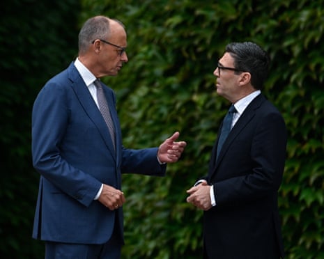 German chancellor Friedrich Merz greets British prime minister Andy Burnham as he arrives at the Chancellery in Berlin.
