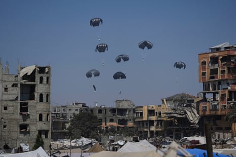 Humanitarian aid is airdropped to Palestinian people over the northern Gaza Strip.