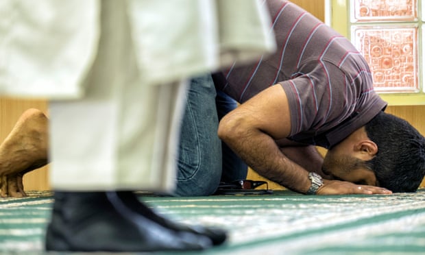 Man praying in a mosque