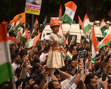 Clock it … Cockroach Janta party supporters celebrate the resignation of Dharmendra Pradhan.
