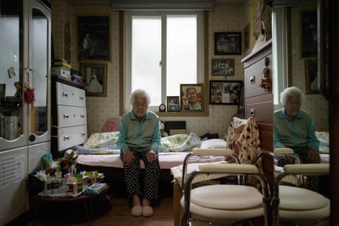 Former comfort woman Lee Ok-sun sits in her bedroom at the ‘Sharing House’, a commune and nursing home for former comfort women, in Toechon village, east of Seoul on April 8, 2018.