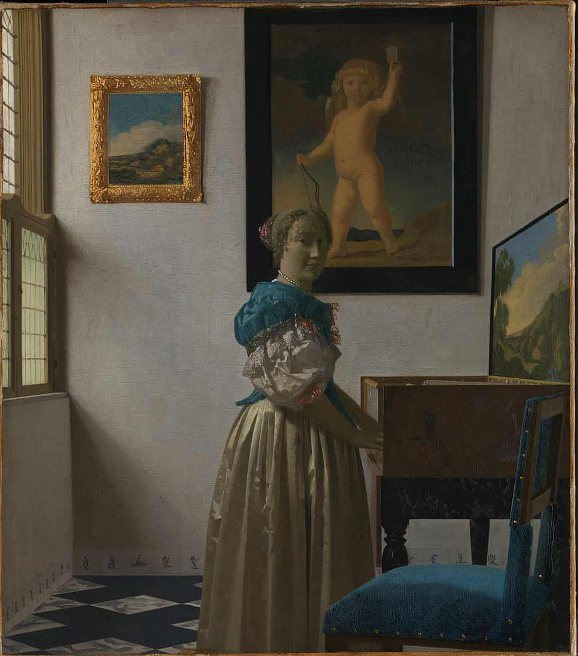 A Young Woman standing at a Virginal by Johannes Vermeer, circa 1670-72