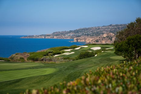 a golf course by the sea