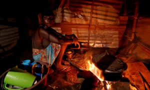 Maria Jofresse, 25, cooking in her makeshift shelter outside the village of Cheia, near Beira, Mozambique, lost her two children during Cyclone Idai, but can’t find their graves anymore. 
