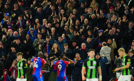 Crystal Palace's Jordan Ayew celebrates scoring the first goal with the fans.
