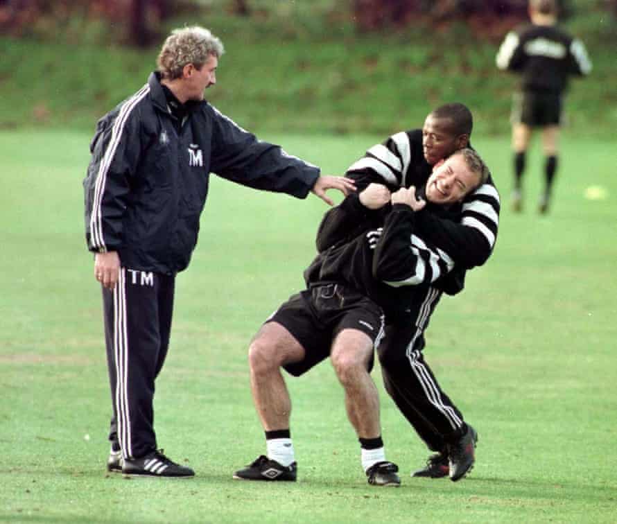 Newcastle coach Terry McDermott tries to put an end to some training ground high-jinks between Asprilla and Alan Shearer in November 1996.