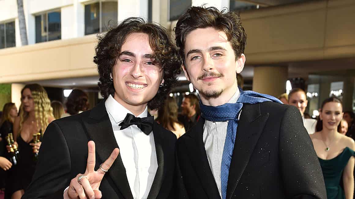 Miles Mitchell (left) and Timothée Chalamet at the 2025 Golden Globes