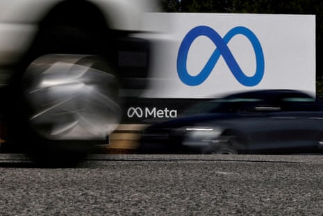 car speeds past blue and white sign for meta