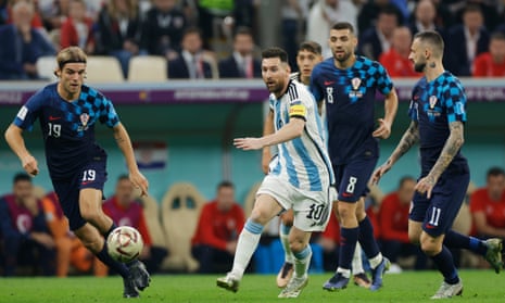 Argentina's Lionel Messi takes on the Croatia defence in their semi-final