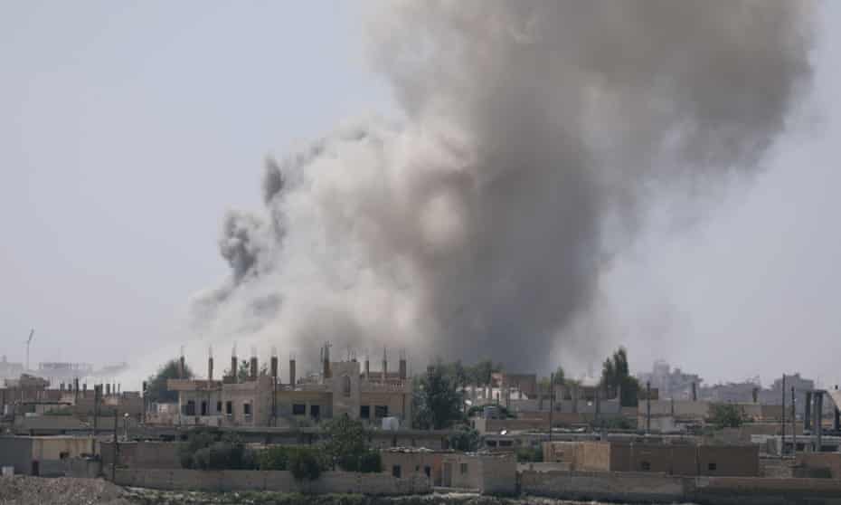 Smoke rises from the al-Mishlab district in Raqqa