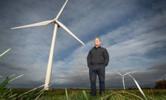 Keir Starmer stands in front of a wind turbine