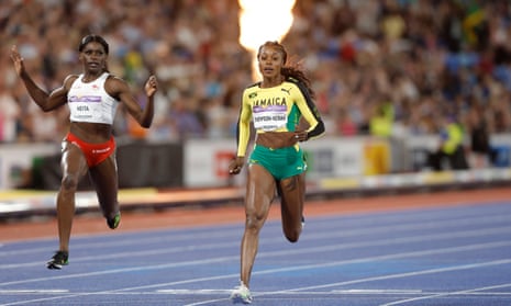 Elaine Thompson-Herah of Jamaica wins the women’s 100m final as England’s Daryll Neita (left) takes bronze.