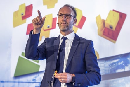 a man in a suit speaks