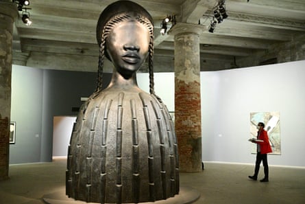 A visitor views Brick House, a bronze sculpture by artist Simone Leigh, at the 59th Venice Art Biennale on 9 April 2022.