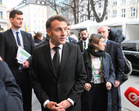 French president Emmanuel Macron (C) arrives to attend the 62nd Munich Security Conference in Munich, Germany.