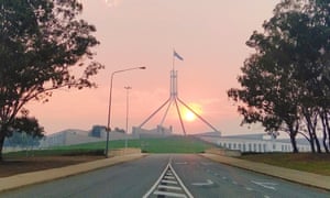 A red and smoky sky above Parliament House in Canberra