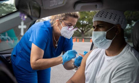 A person receives a Covid vaccine in Miami in December 2021. 