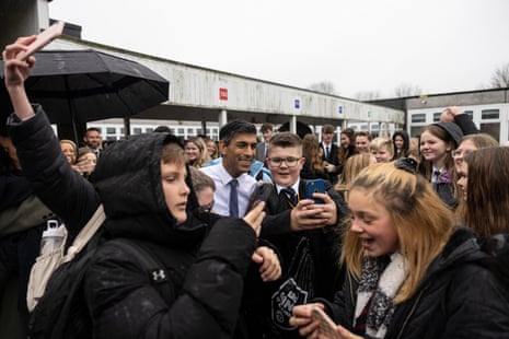 Rishi Sunak posing for a selfie with pupils on a visit to Eramus Darwin Academy in Burntwood today.