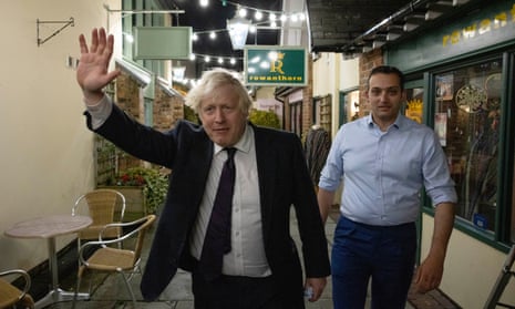 Boris Johnson with the Conservative party candidate for the North Shropshire byelection, Neil Shastri-Hurst, in Oswestry, 3 December 2021.