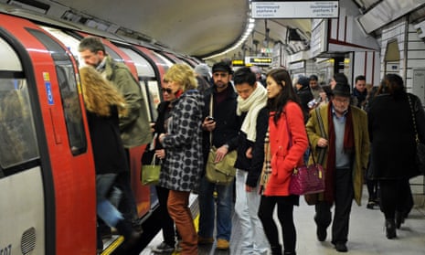 Commuters embarking a London tube train