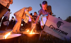 Egyptians light candles during a candlelight vigil for the 66 victims of the EgyptAir MS804 flight that crashed in the Mediterranean Sea