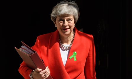 Theresa May in a bright suit.