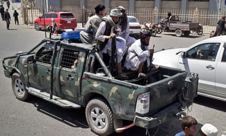 Taliban fighters in a vehicle belonging to the Afghan National Directorate of Security in Kandahar