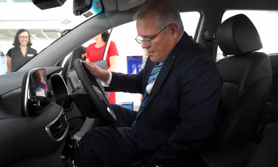 Scott Morrison in a non-electric car.