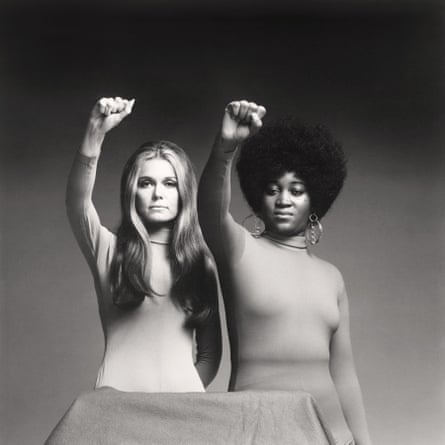 Gloria Steinem and Dorothy Pitman Hughes raise their fists in a Black Panther pose in a photograph from 1971