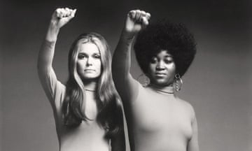 Gloria Steinem and Dorothy Pitman Hughes raise their fists in a Black Panther pose in a photograph from 1971