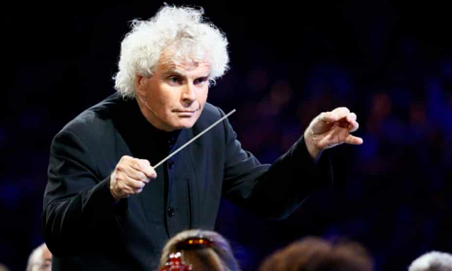 Conductor Simon Rattle takes part in the opening ceremony of the London 2012 Olympic Games