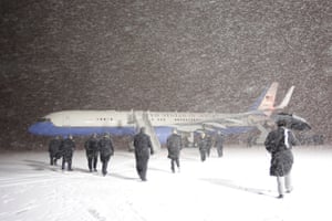 Ontario, Canada: Officials walk towards a plane carrying Joe Biden