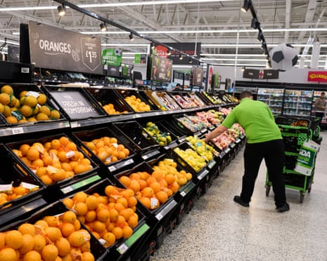 Shoppers in the fresh fruit section at Asda supermarket in Leeds