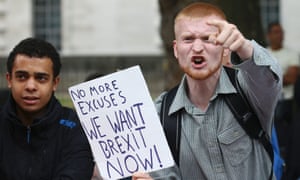 A Brexit supporter shouts at pro-Europe marchers