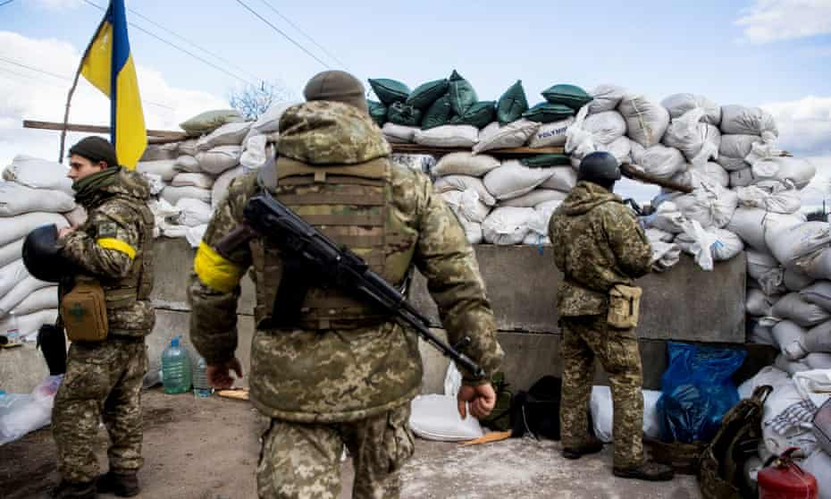 Ukrainian service members at a check point in the city of Zhytomyr, Ukraine.