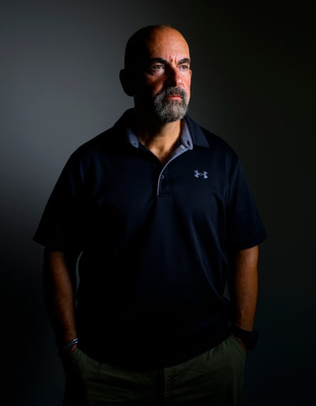 Marc Polymeropoulos poses looking away away from the camera