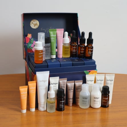 Jurlique Advent calendar open on a table, with its beauty products arranged alongside it
