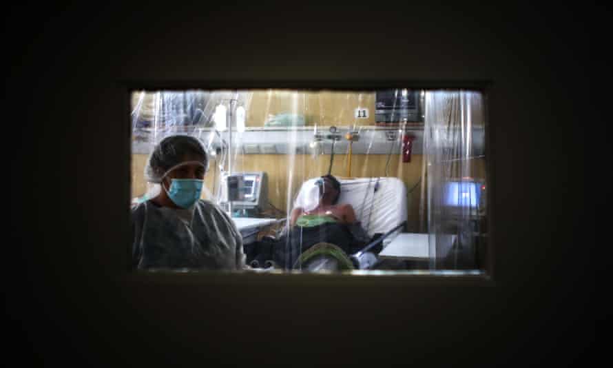 A healthcare worker and patient at an intensive care unit in Buenos Aires.