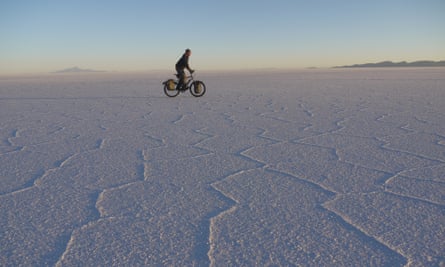 Stephen Fabes on his bicycle crossing a salt plain.