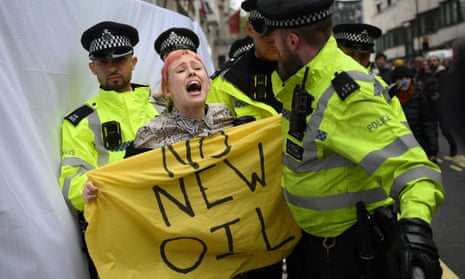 A climate activist protesting in London against the Rosebank oil field project in the North Sea off the coast of Scotland