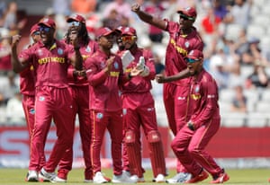 West Indies players celebrate Colin Munro's shutter.
