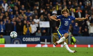 Marcos Alonso slips as he scores his penalty.
