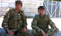 Two men in army uniforms with their faces blurred out