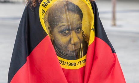 Woman in the Aboriginal flag