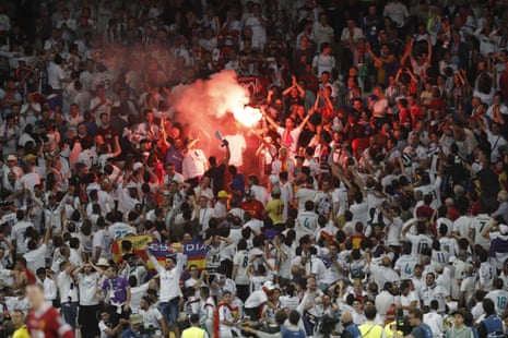 The Real Madrid fans celebrate Bales super strike.